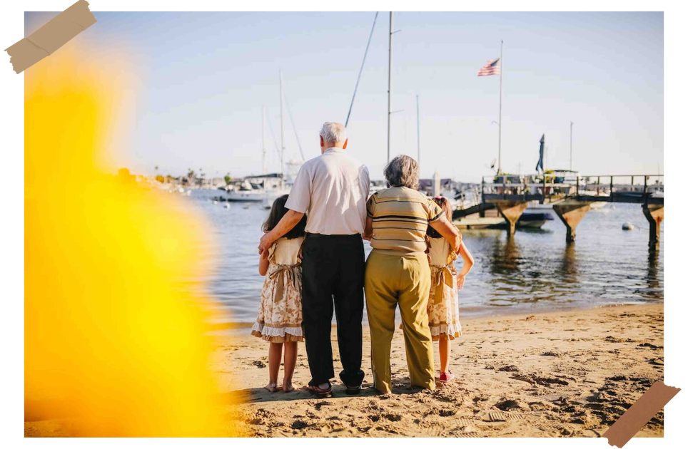 Grandparents with grandchildren on a beach holiday